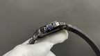 Cartier steel wristwatch with black leather strap and blue gemstone bezel