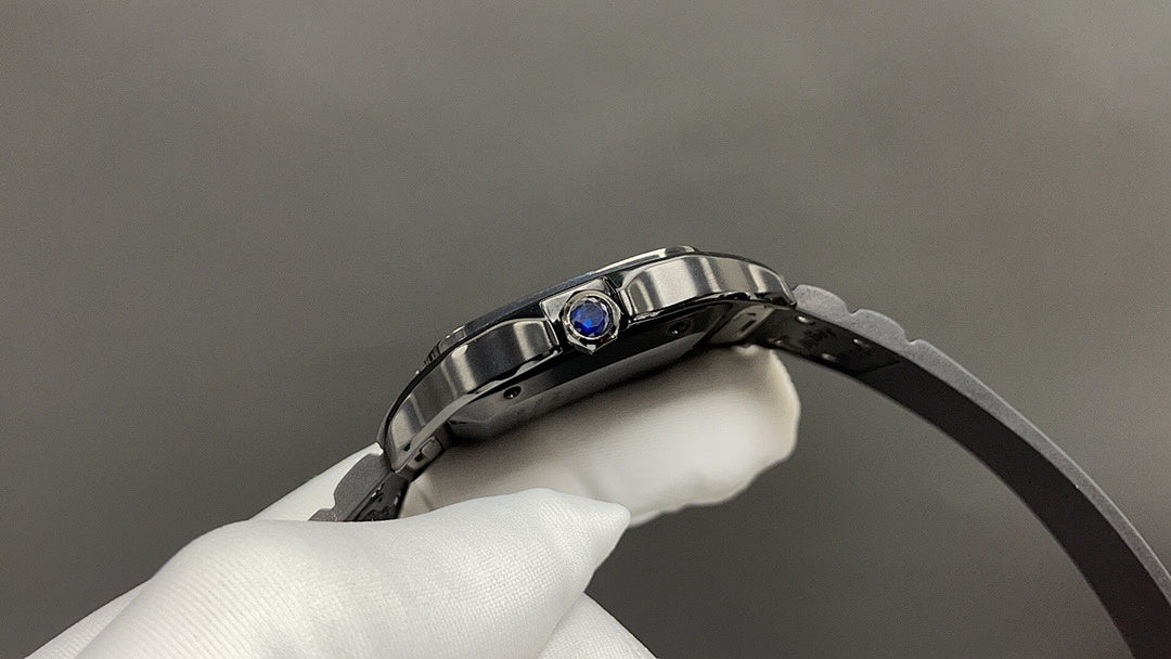 Cartier steel wristwatch with black leather strap and blue gemstone bezel