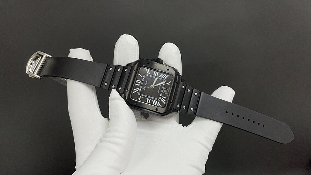 Cartier black strap wristwatch with Roman numerals, buckle and clasp visible