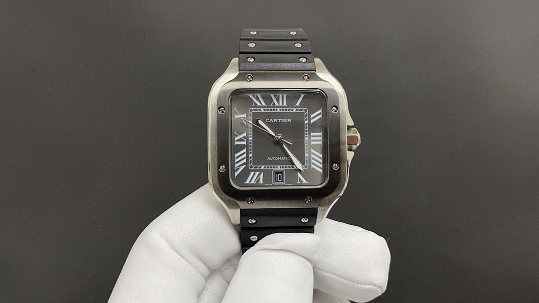 Cartier stainless-steel wristwatch with black dial and black leather strap.