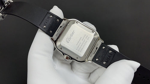 Cartier wristwatch with silver case and black leather strap, clasp and strap holes.