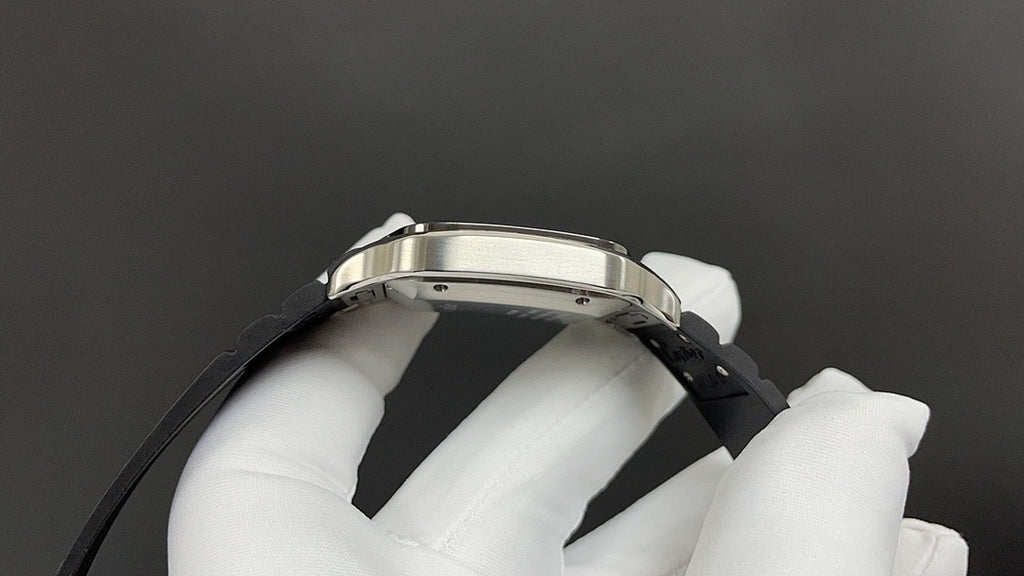 Cartier wristwatch side view with silver case and black leather strap.