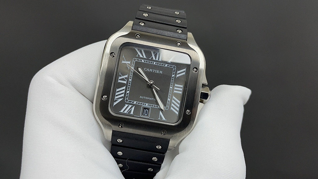 Cartier wristwatch with black dial, Roman numerals, and black leather strap.