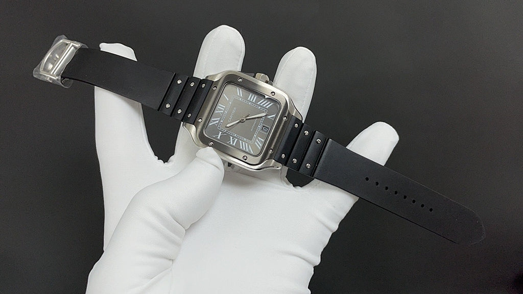 Cartier wristwatch on black leather strap with silver case and Roman numeral dial.
