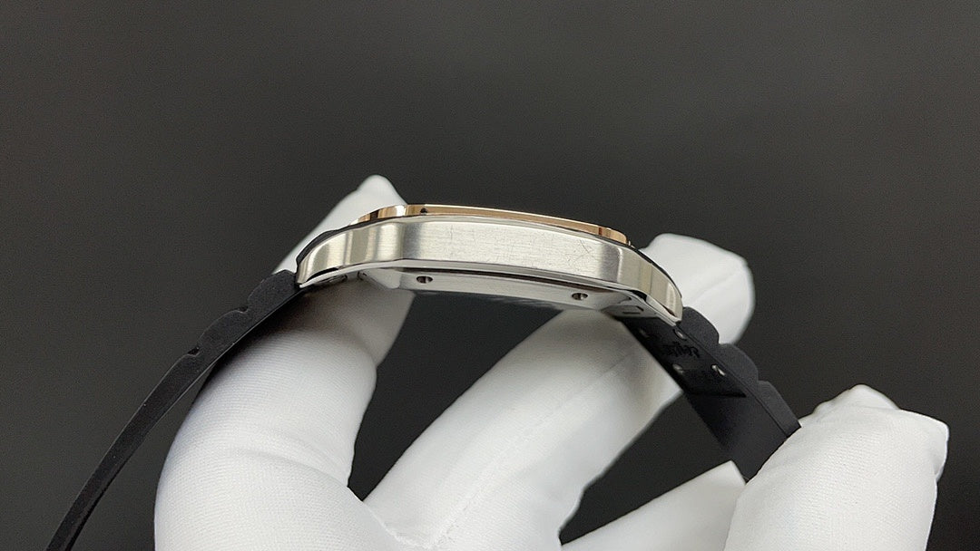 Cartier watch bezel and black strap close-up held in white-gloved hand