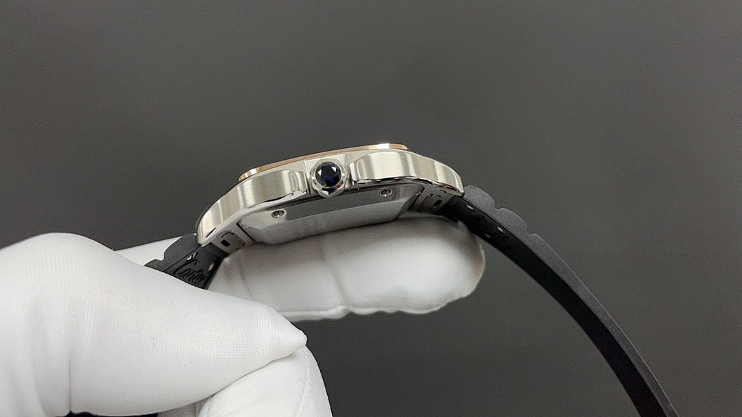 Cartier watch crown and blue lens on metal bezel, black strap