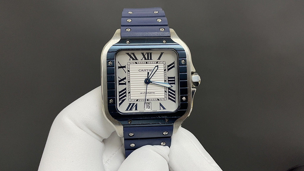 Cartier watch with blue dial, Roman numerals, and blue leather strap