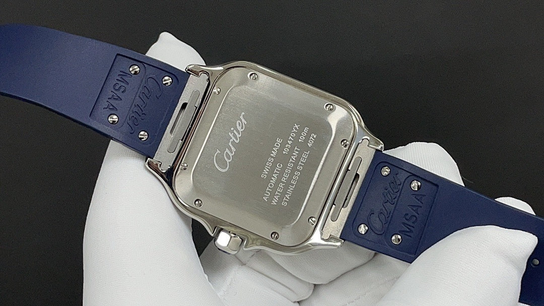 Cartier watch with engraved case back and blue leather strap, held on glove