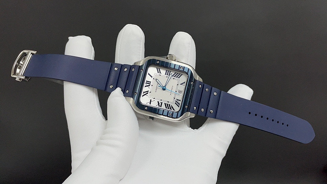 Cartier watch with blue leather strap and rectangular case, shown on wrist