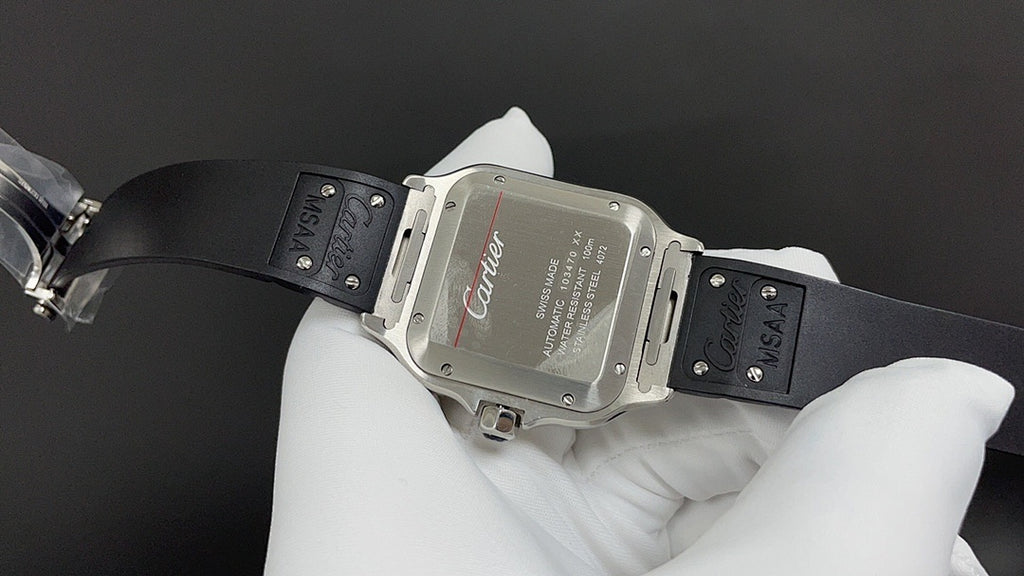 Silver-toned square wristwatch with black leather strap, clasp and red Cartier script
