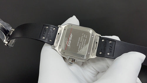 Silver-toned square wristwatch with black leather strap, clasp and red Cartier script