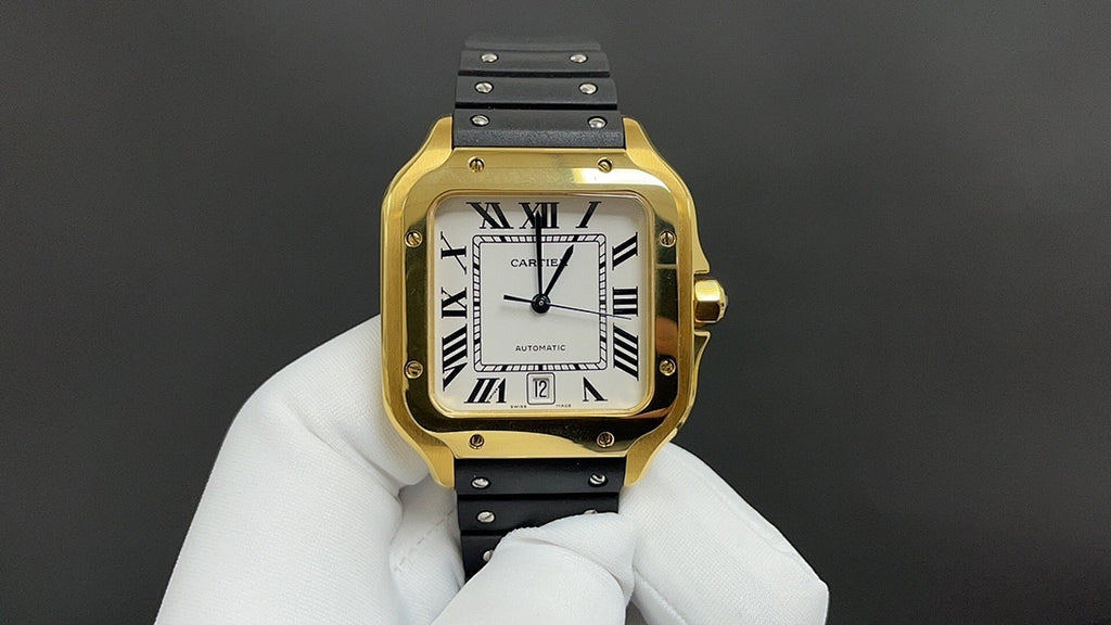 Gold Cartier watch with black leather strap and white dial, Roman numerals, visible hands