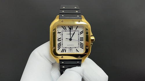 Gold Cartier watch with black leather strap and white dial, Roman numerals, visible hands