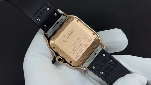 Cartier watch back view with gold-toned case, black strap, clasp and engraved panel