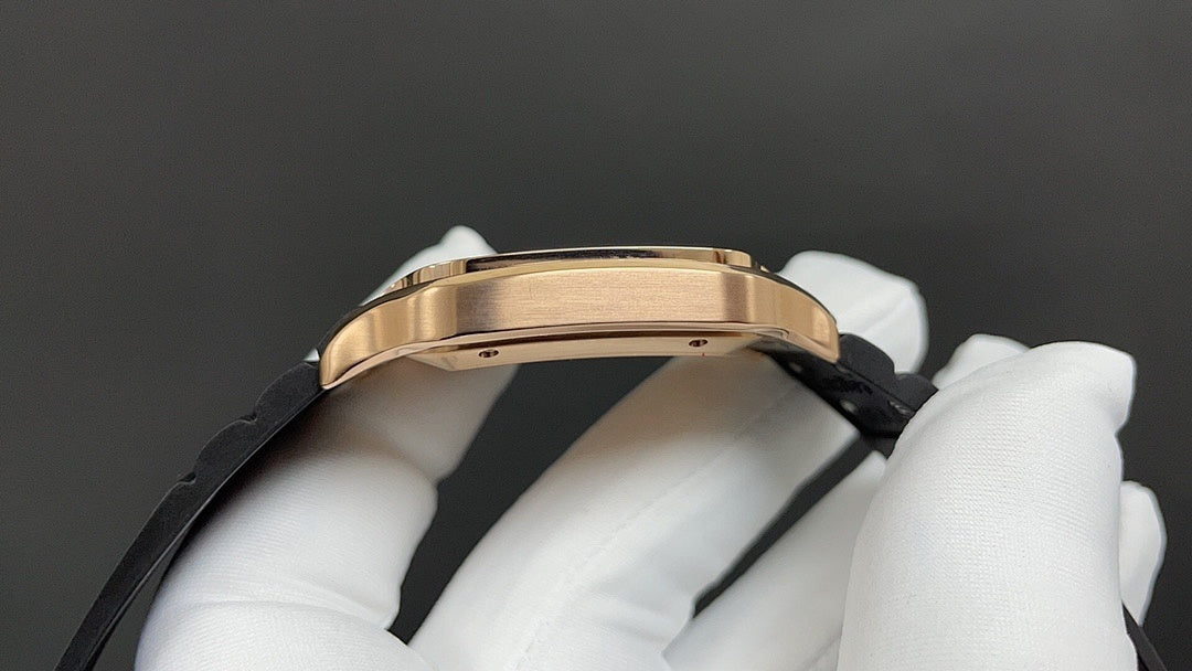 Cartier watch side view with gold-toned case and black strap held in white gloves