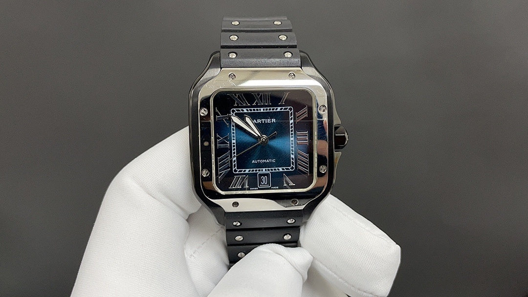 Cartier Santos watch with blue dial and black strap, held in white gloves.