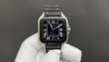 Men's Cartier watch with black dial, Roman numerals, steel case, black leather strap