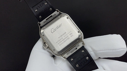 Cartier watch caseback with engraved silver back plate and black leather strap