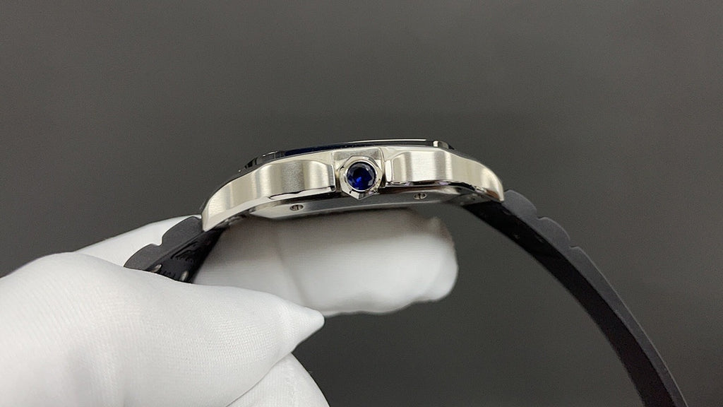 Cartier watch close-up with crown detail, silver case, and black leather strap