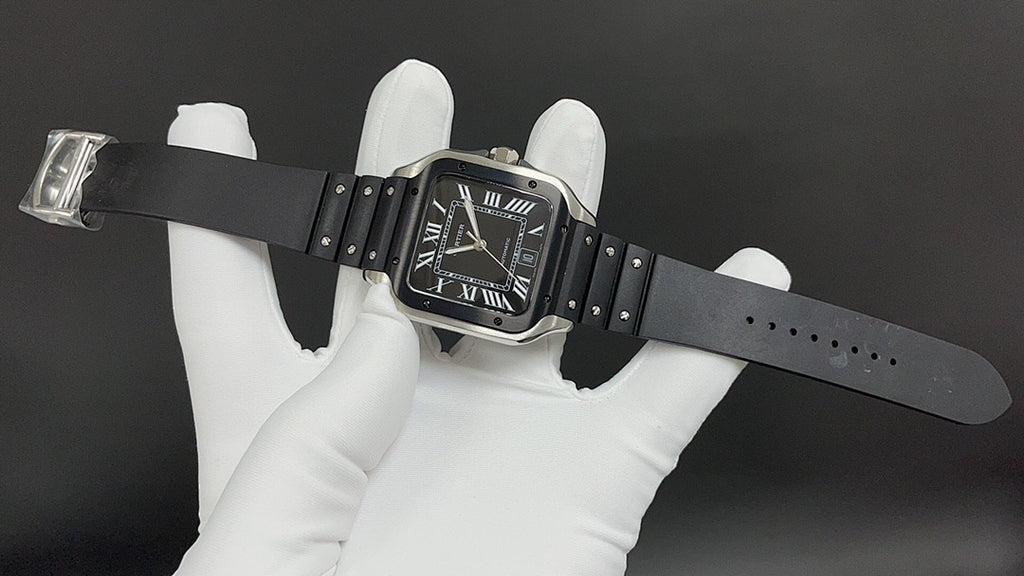 Cartier watch with black leather strap, steel case, and black Roman numeral dial