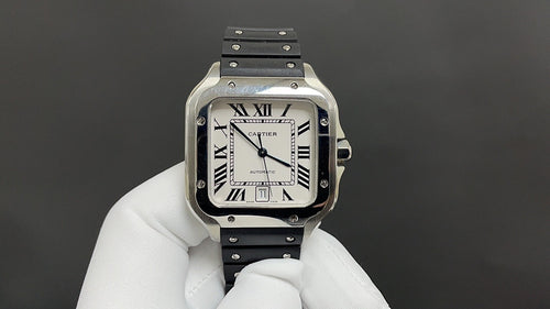 Cartier watch with square silver case, Roman numeral dial, black leather strap.