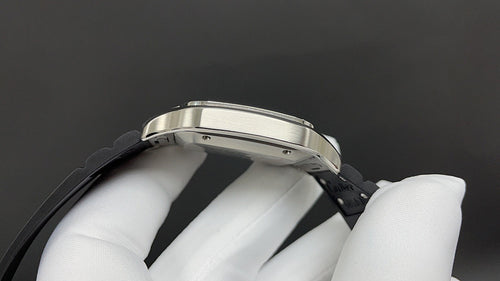 Cartier watch side profile with silver case edge and black leather strap.