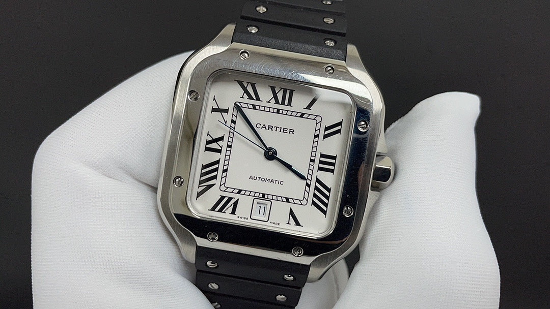 Cartier watch with silver frame, Roman numeral dial, and black leather strap detail.