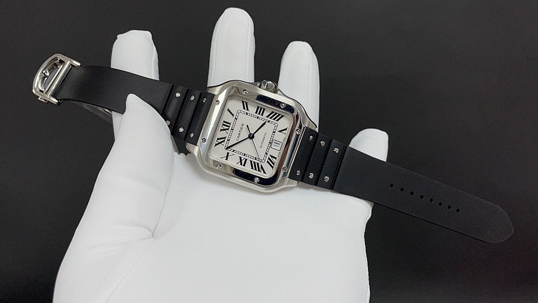 Cartier watch angled on glove, square Roman numeral dial and black leather strap.