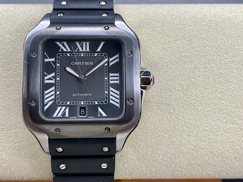 Cartier watch with black dial, Roman numerals, automatic text, and black strap