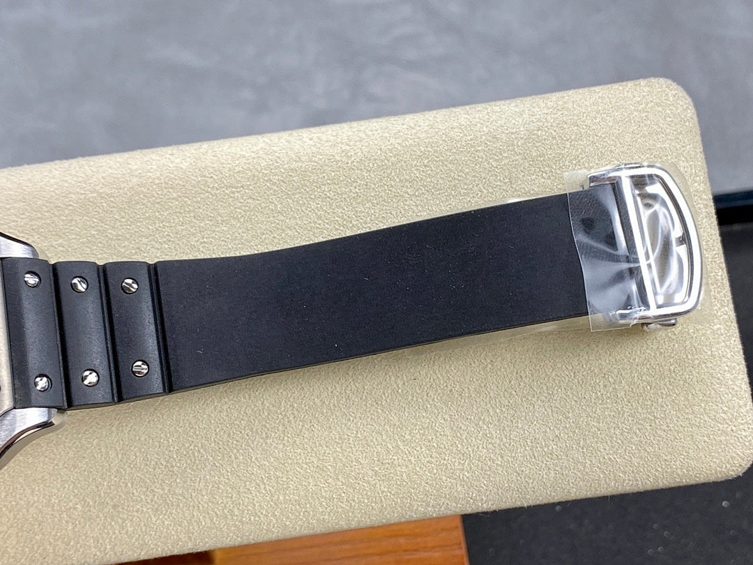 Cartier watch with black rubber strap and silver buckle clasp at the end