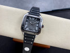 Cartier watch on black strap with Roman numeral black dial and silver case