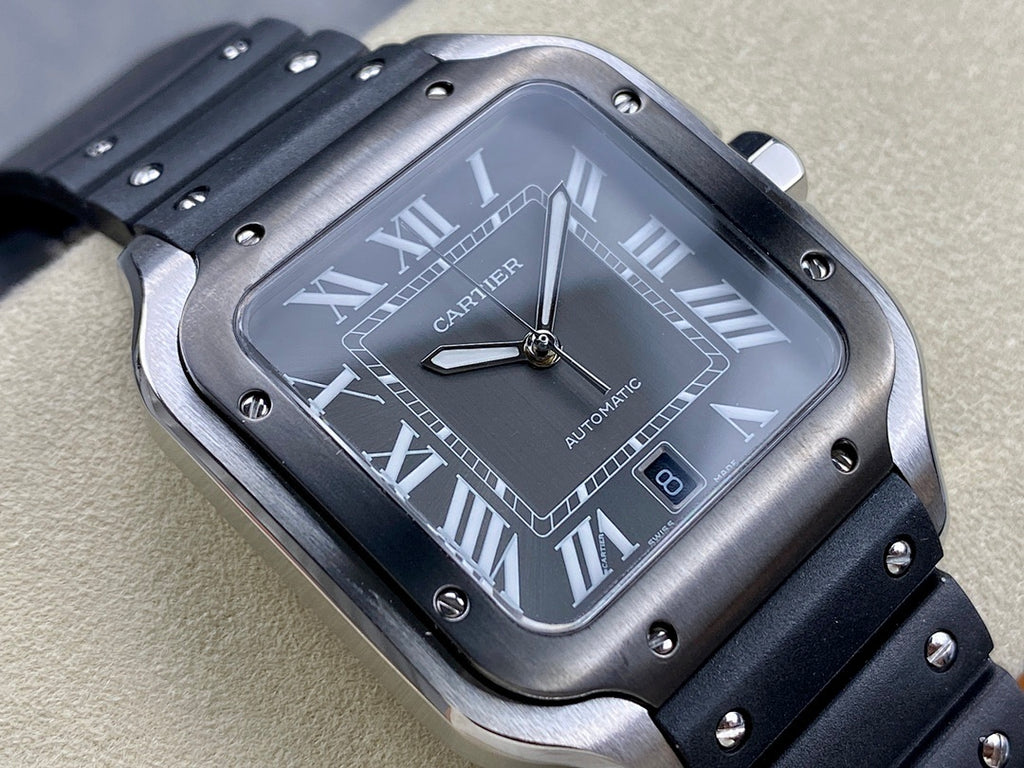 Cartier watch close-up of black dial with Roman numerals and automatic label