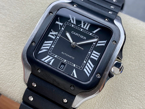 Cartier wristwatch close-up with black dial, Roman numerals, and black metal bracelet details.