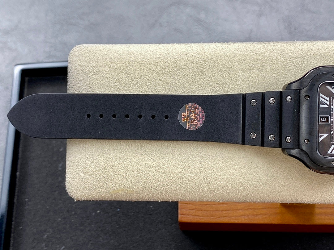 Dark leather-style wristwatch strap with metal buckle and round stamped logo