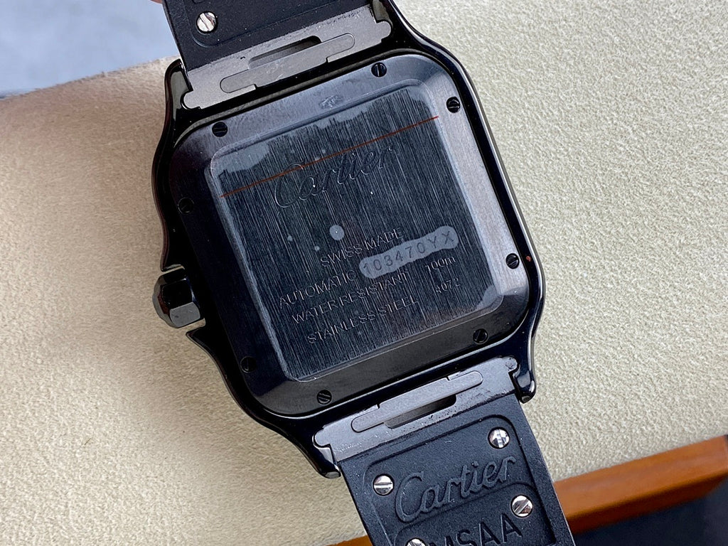 Wristwatch case back with engraved text and screws on dark metal housing