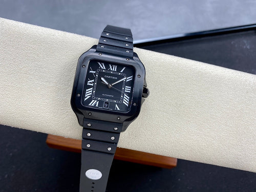 Square luxury wristwatch with dark dial, Roman numerals, and dark link bracelet