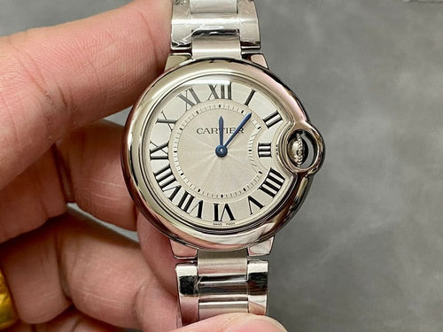 Cartier watch front view with silver case, Roman numeral dial, blue seconds hand