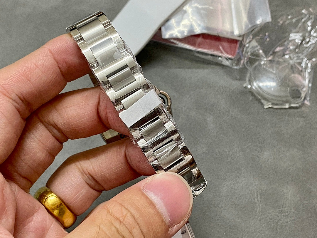 Cartier watch bracelet and clasp in silver metal, hinged links visible