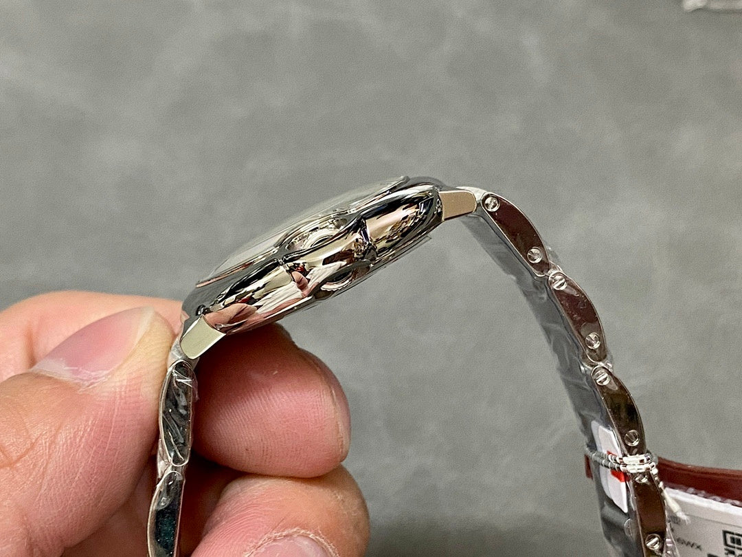 Cartier watch side profile with silver metal case and polished bezel