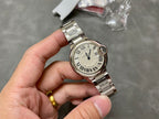 Cartier watch on wristband, silver case with Roman numeral dial and blue seconds hand