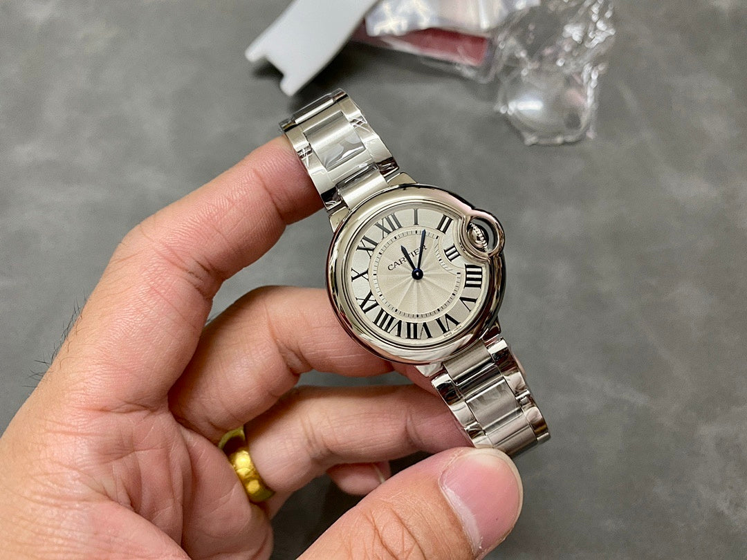 Cartier watch on wristband, silver case with Roman numeral dial and blue seconds hand