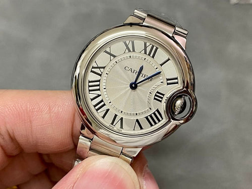 Cartier watch with silver round case, Roman numeral dial, blue center seconds hand