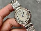 Cartier watch close-up with silver round case, Roman numeral dial and blue seconds hand