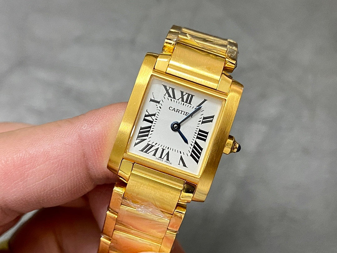 Gold-tone Cartier wristwatch with square face, Roman numerals, and metal bracelet