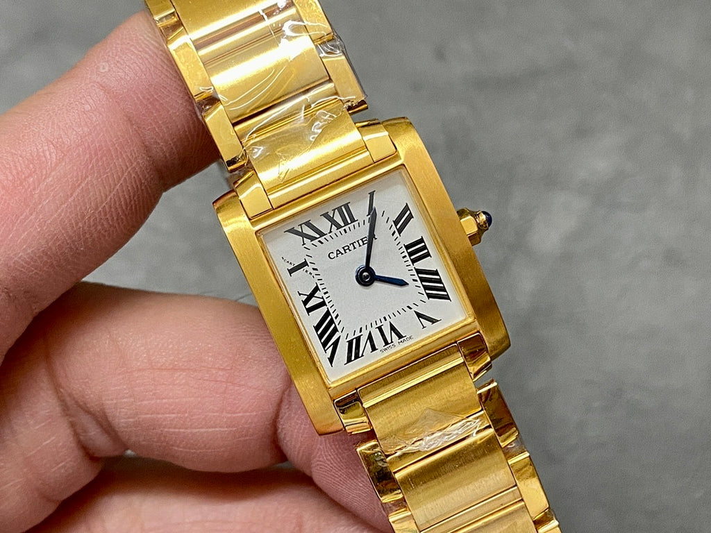 Gold-tone Cartier wristwatch with square dial, Roman numerals, and black hands