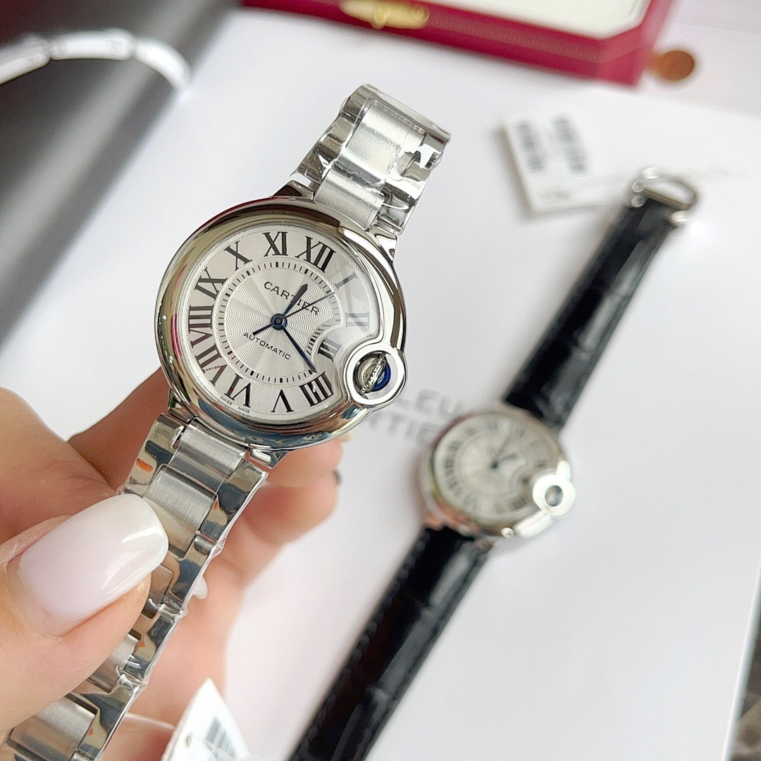 Stainless steel wristwatch with white Roman-numeral dial and bracelet, angled view.