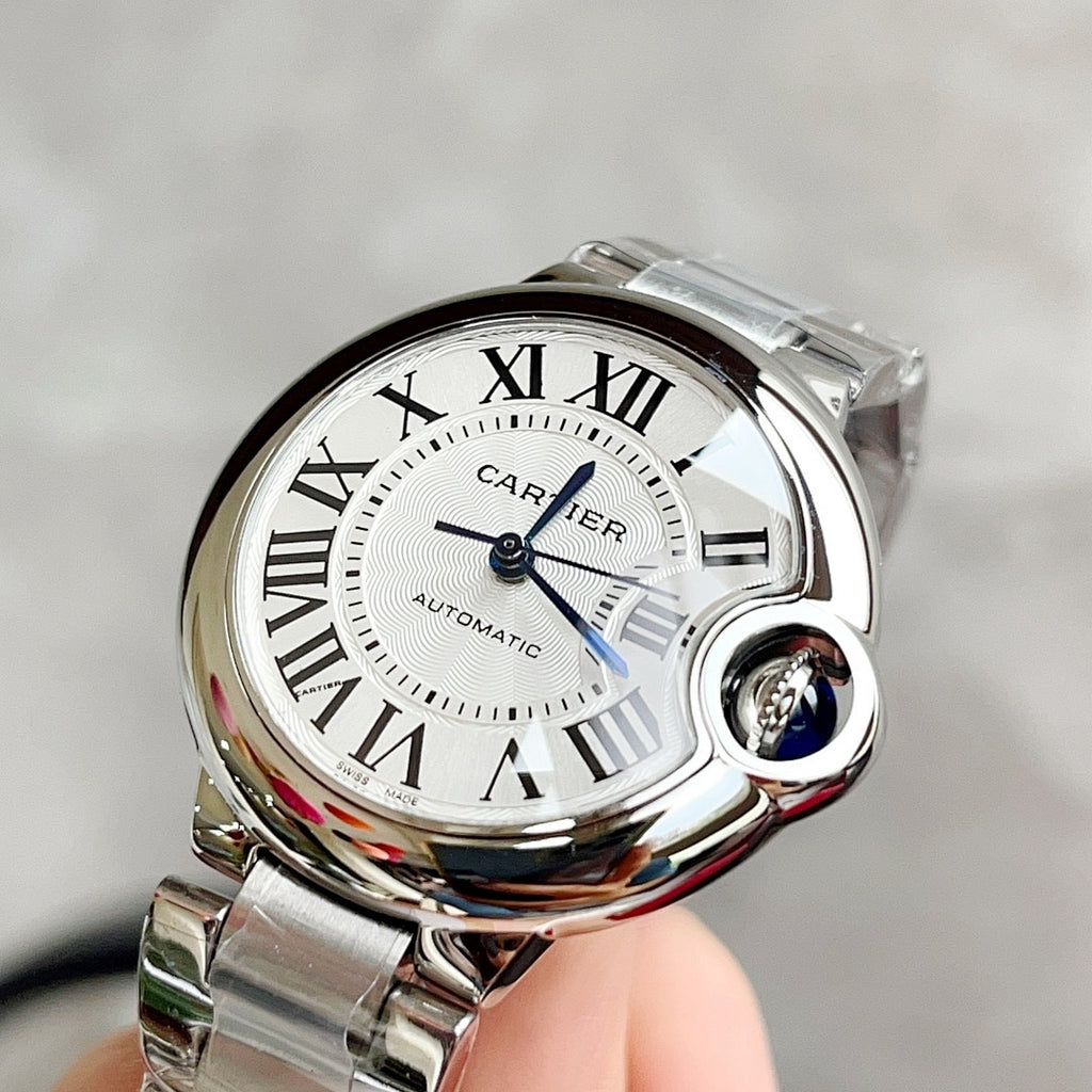 Stainless steel wristwatch with white Roman-numeral dial and subdial, automatic.
