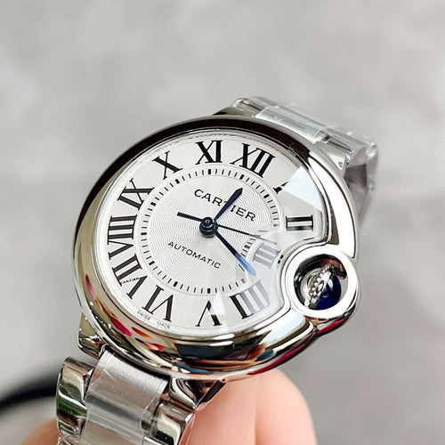 Stainless steel wristwatch with white Roman-numeral dial and subdial, automatic.