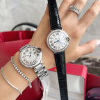 Cartier Ballon Bleu watches with black leather straps, white dials and diamond bezels