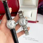 Cartier Ballon Bleu watch pair on black leather straps with white dials and blue hands